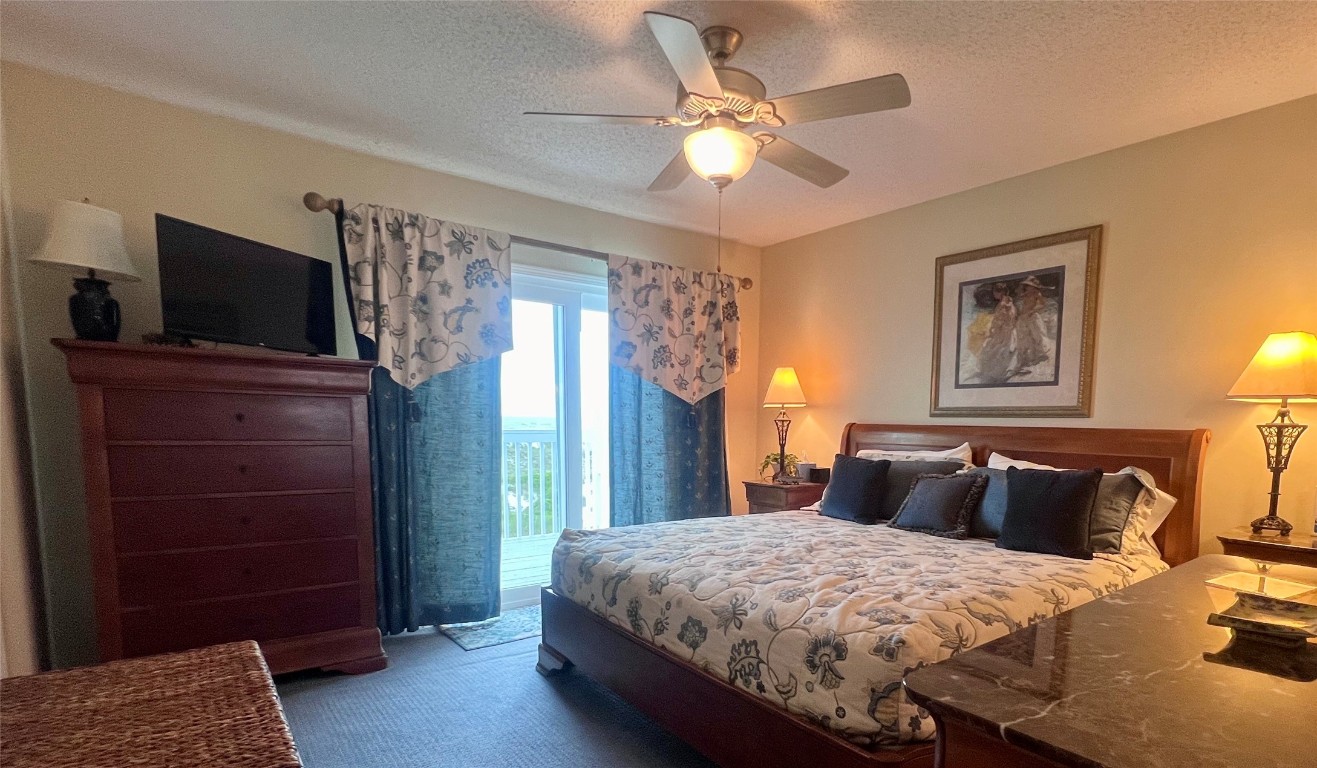 95116 Sandpiper Loop Fernandina Beach, FL 32034 - Photo 16 of 40 a bedroom with a bed and a television