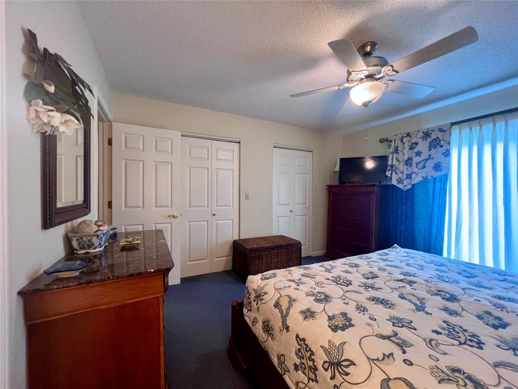 95116 Sandpiper Loop Fernandina Beach, FL 32034 - Photo 17 of 40 a bedroom with a bed and dresser