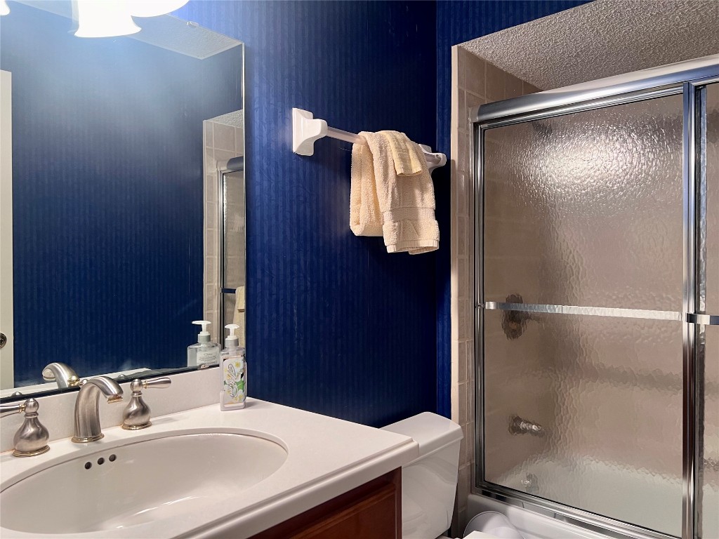 95116 Sandpiper Loop Fernandina Beach, FL 32034 - Photo 22 of 40 a bathroom with a sink and mirror
