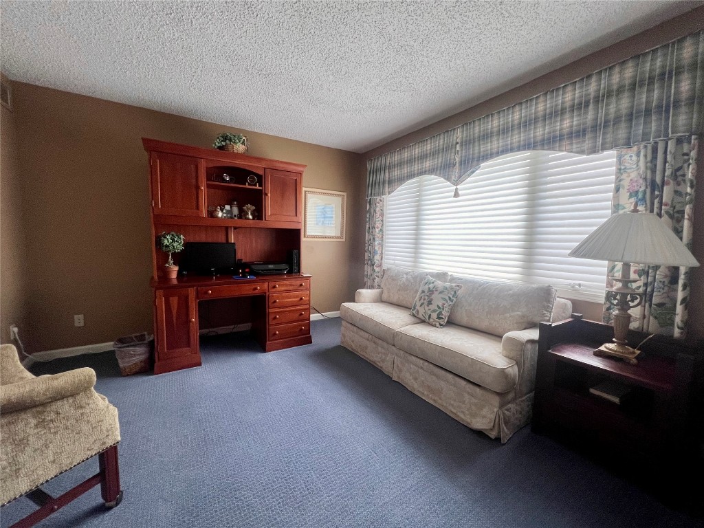 95116 Sandpiper Loop Fernandina Beach, FL 32034 - Photo 23 of 40 a living room with furniture and a lamp