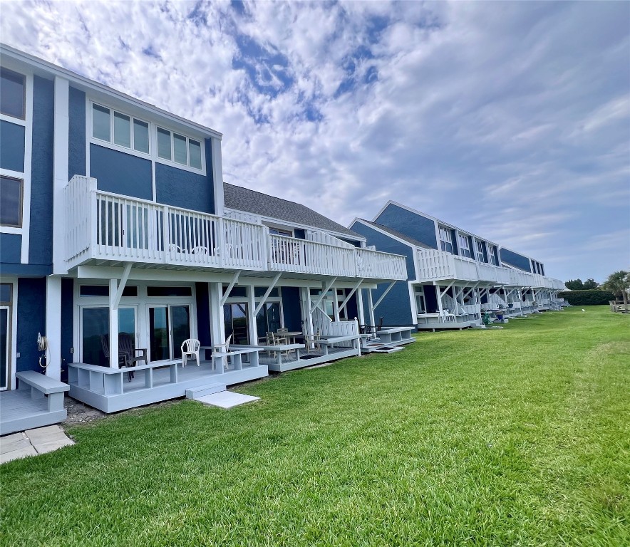 95116 Sandpiper Loop Fernandina Beach, FL 32034 - Photo 33 of 40 a view of a house with a yard and sitting area