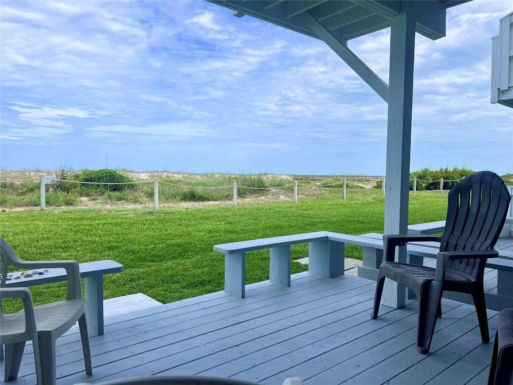 95116 Sandpiper Loop Fernandina Beach, FL 32034 - Photo 8 of 40 a view of a chairs and table on the wooden floor next to a yard