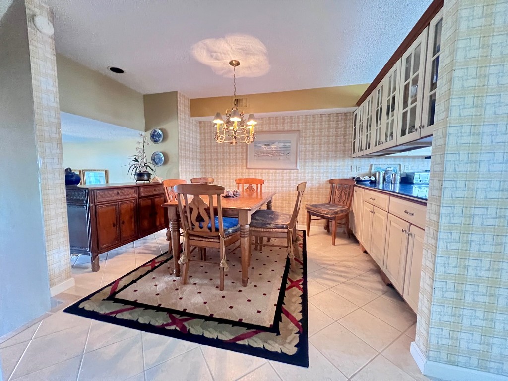 95116 Sandpiper Loop Fernandina Beach, FL 32034 - Photo 10 of 40 a dining room with furniture and chandelier