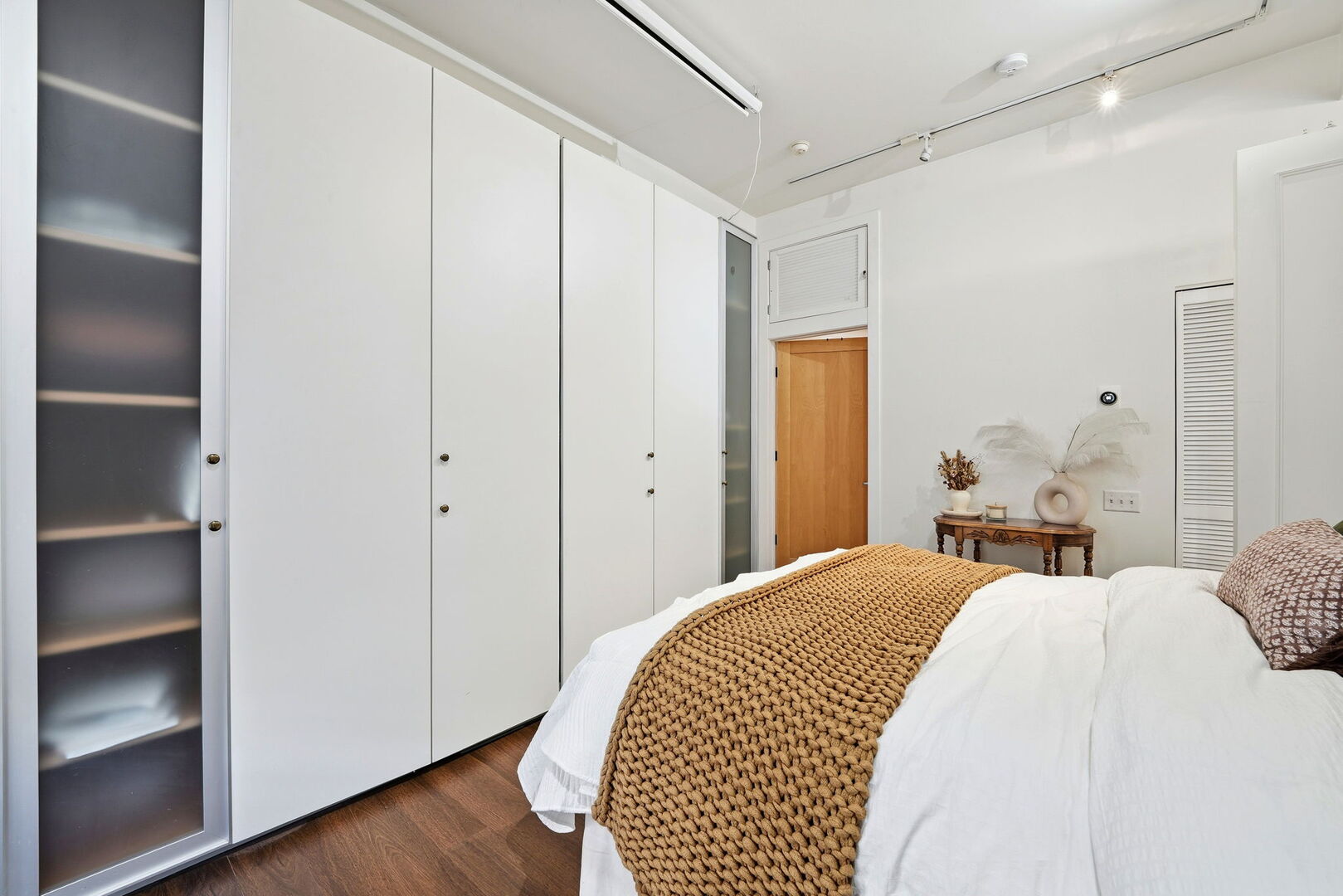 949 West Madison Street, Unit 304 Chicago, IL 60607 - Photo 12 of 21 a bedroom with a bed and a closet