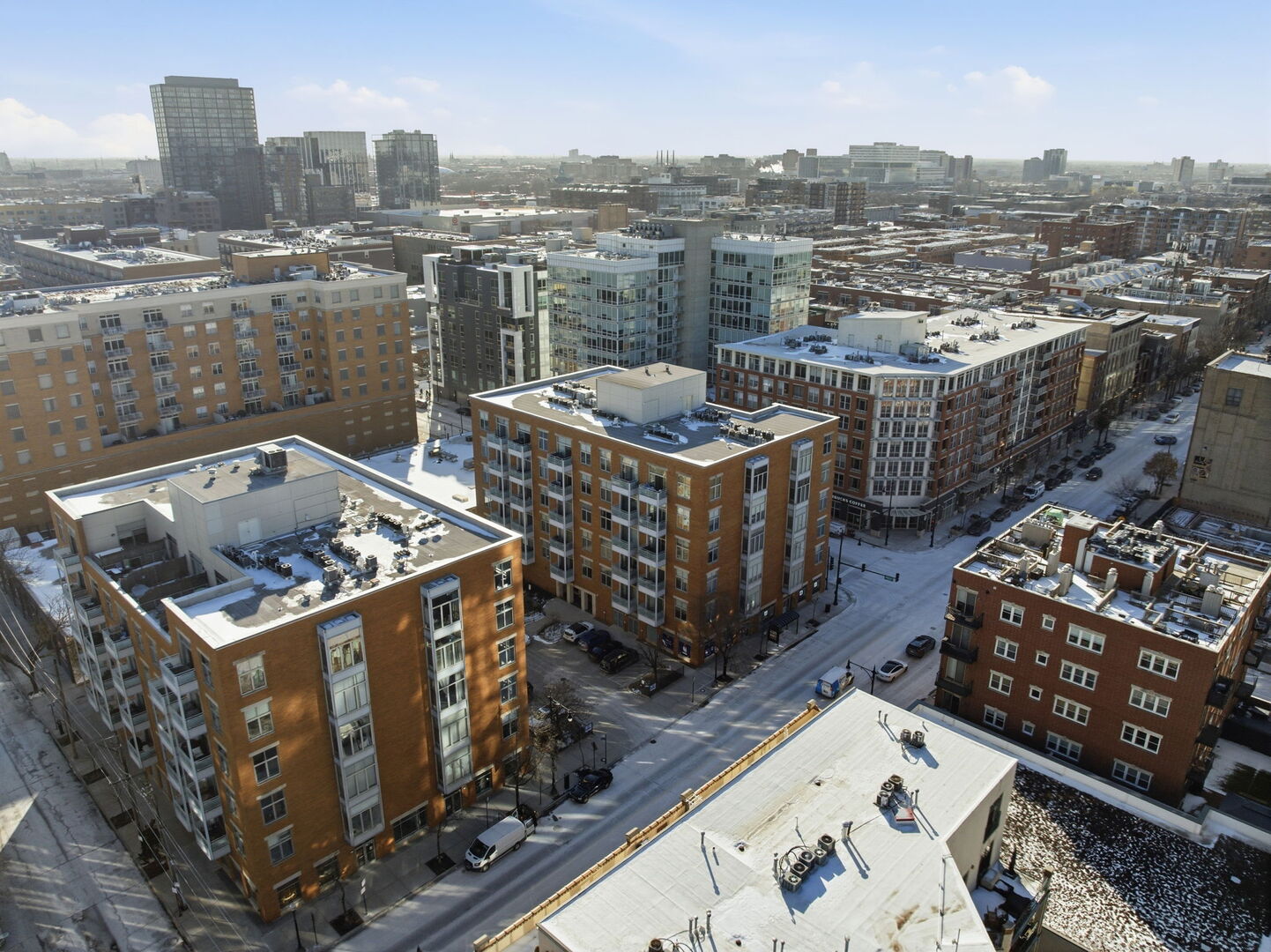 949 West Madison Street, Unit 304 Chicago, IL 60607 - Photo 18 of 21 a view of a balcony with wooden chairs