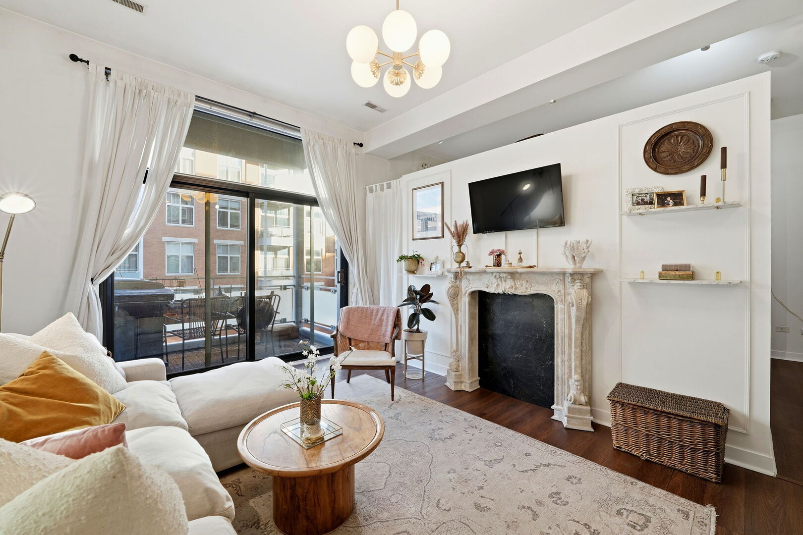 949 West Madison Street, Unit 304 Chicago, IL 60607 - Photo 3 of 21 a living room with furniture a fireplace and a flat screen tv