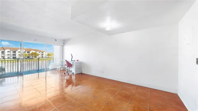 a bedroom with bed and wooden floor
