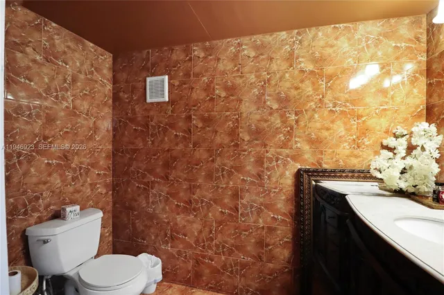 a bedroom with a bed and a night stand