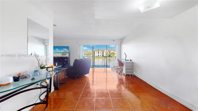 a living room with furniture a window and a table