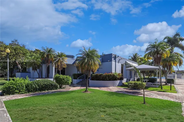 a sign on a wall next to a road