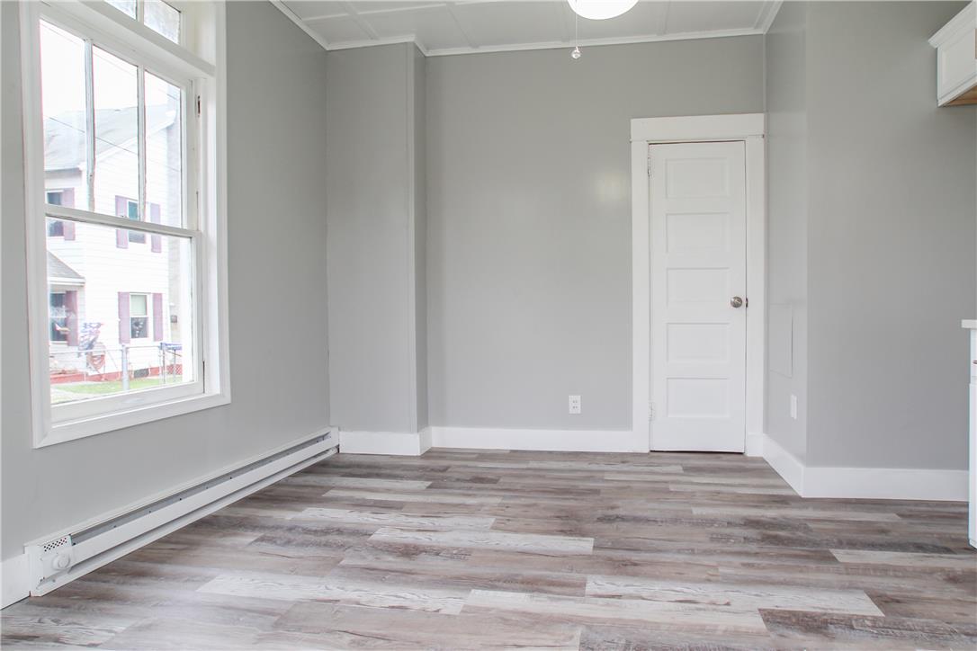 933 Philadelphia Road Easton, PA 18042 - Photo 19 of 23 Plank flooring and a classic wood sash window define this versatile interior space.