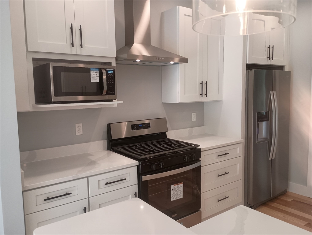 73 Depot Road Leverett, MA 01054 - Photo 11 of 39 a kitchen with stainless steel appliances granite countertop a stove and a refrigerator