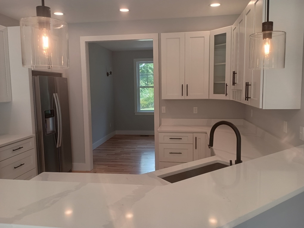 73 Depot Road Leverett, MA 01054 - Photo 12 of 39 a kitchen with a refrigerator and a sink