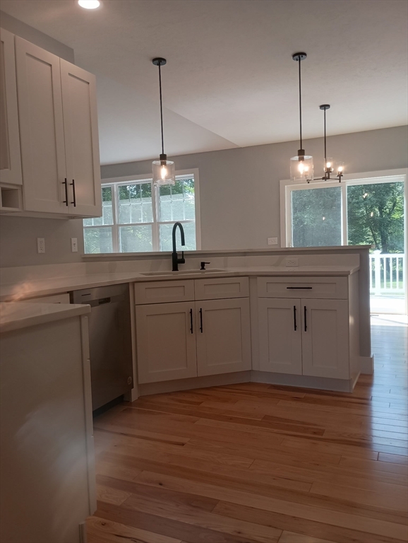 73 Depot Road Leverett, MA 01054 - Photo 13 of 39 a kitchen with a sink cabinets and wooden floor