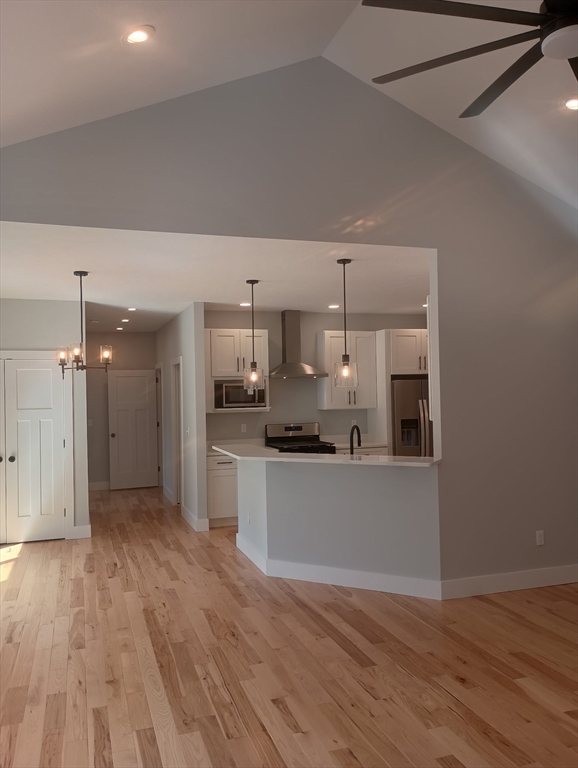 73 Depot Road Leverett, MA 01054 - Photo 14 of 39 a kitchen with kitchen island a counter top space a sink and cabinets
