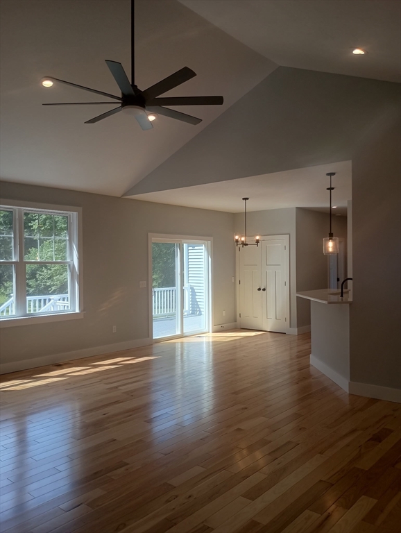 73 Depot Road Leverett, MA 01054 - Photo 15 of 39 an empty room with wooden floor fan and windows