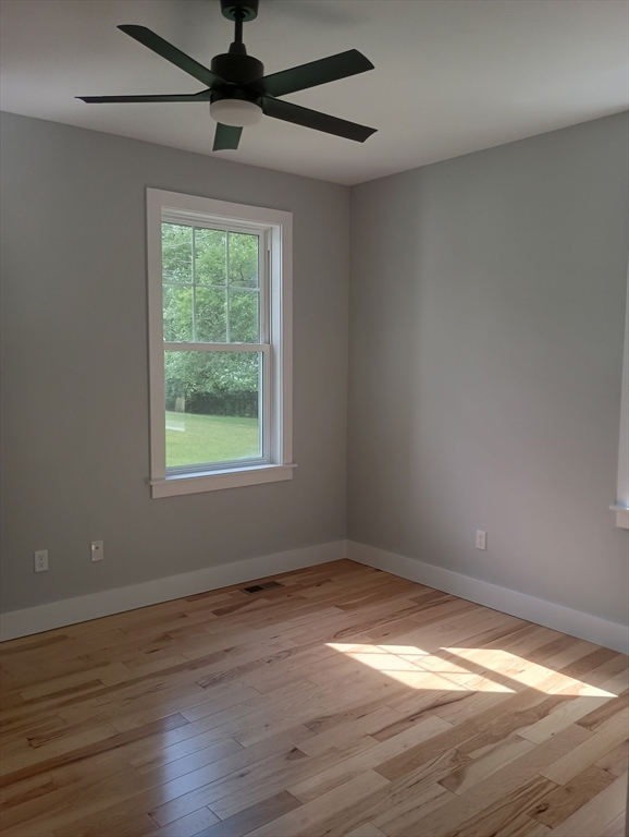 73 Depot Road Leverett, MA 01054 - Photo 21 of 39 a view of empty room with wooden floor and fan