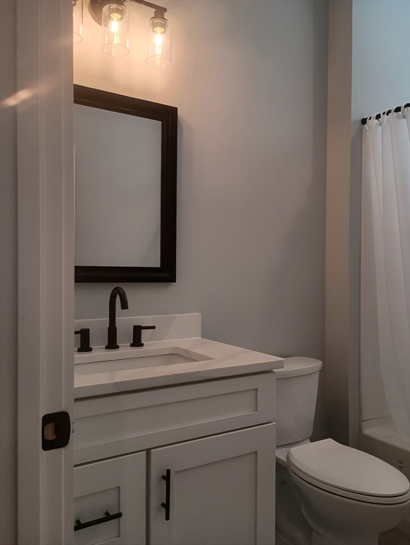 73 Depot Road Leverett, MA 01054 - Photo 23 of 39 a bathroom with a toilet sink and mirror