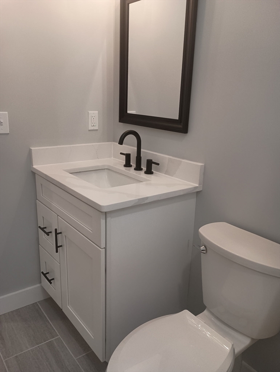 73 Depot Road Leverett, MA 01054 - Photo 24 of 39 a bathroom with a toilet sink and mirror