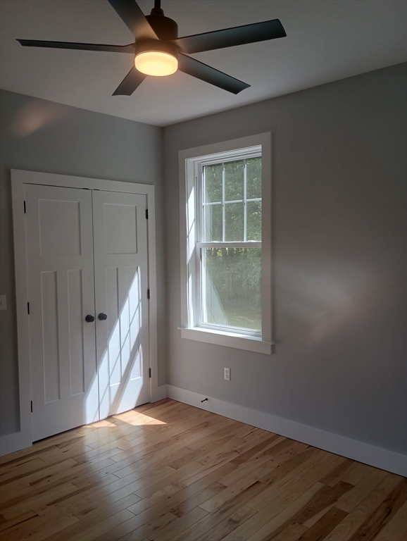 73 Depot Road Leverett, MA 01054 - Photo 29 of 39 an empty room with wooden floor and windows