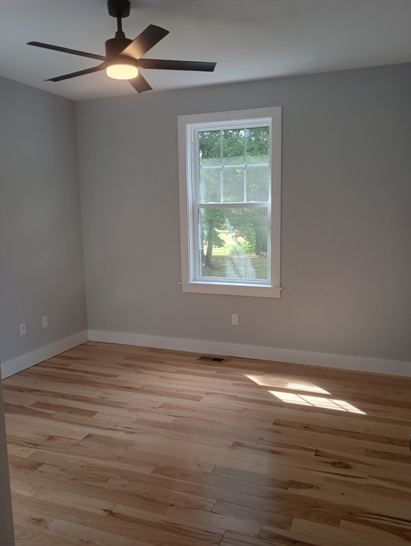 73 Depot Road Leverett, MA 01054 - Photo 30 of 39 a view of an empty room with wooden floor and a window