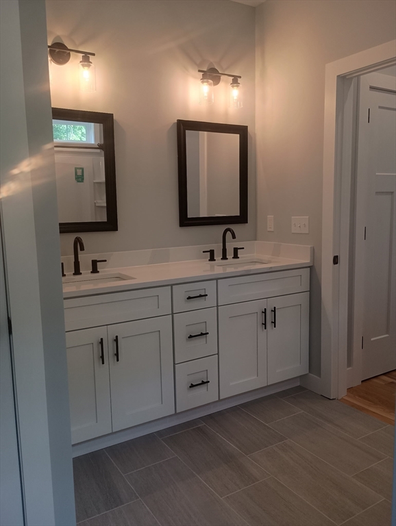 73 Depot Road Leverett, MA 01054 - Photo 37 of 39 a bathroom with double sink and a mirror