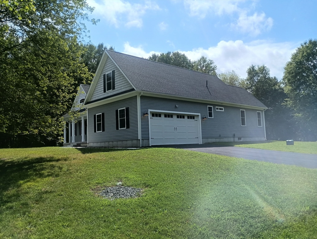 73 Depot Road Leverett, MA 01054 - Photo 5 of 39 a front view of a house with a yard