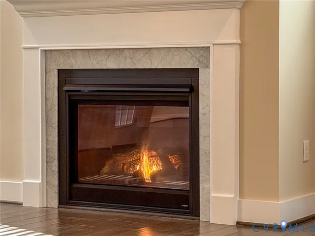 a view of fireplace with wooden floor