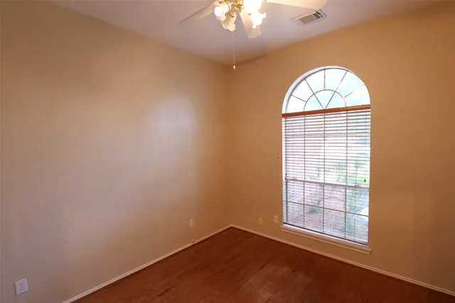 an empty room with a empty space and windows