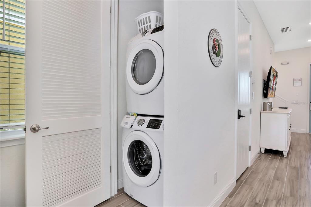 8038 Surf Street Kissimmee, FL 34747 - Photo 15 of 81 a view of a hallway with washer and dryer