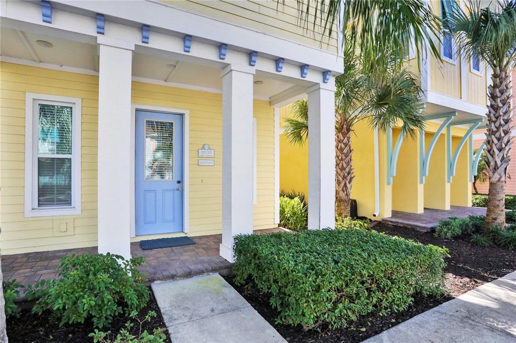 8038 Surf Street Kissimmee, FL 34747 - Photo 22 of 81 a front view of a house with a garden