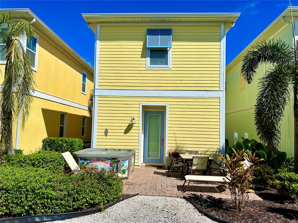 8038 Surf Street Kissimmee, FL 34747 - Photo 24 of 81 a view of a house with a small window and potted plants