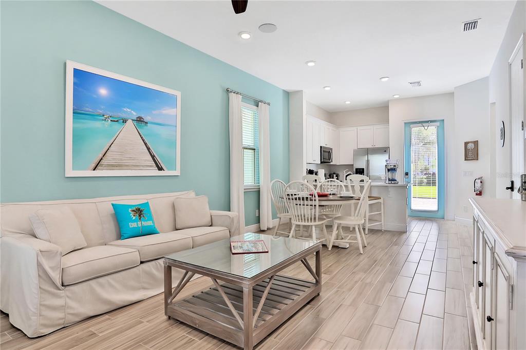 8038 Surf Street Kissimmee, FL 34747 - Photo 3 of 81 a living room with furniture and wooden floor