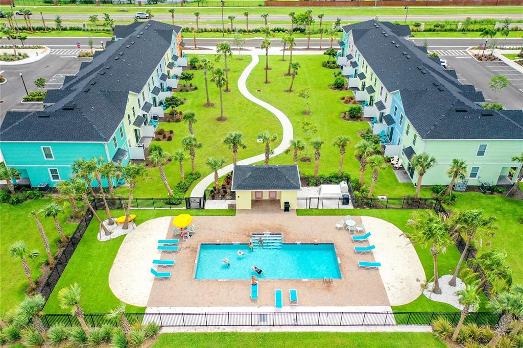8038 Surf Street Kissimmee, FL 34747 - Photo 73 of 81 an aerial view of a swimming pool with a yard and plants