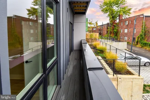 a view of swimming pool from a balcony