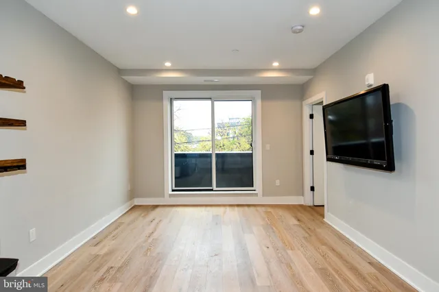 a view of a livingroom with a flat screen tv
