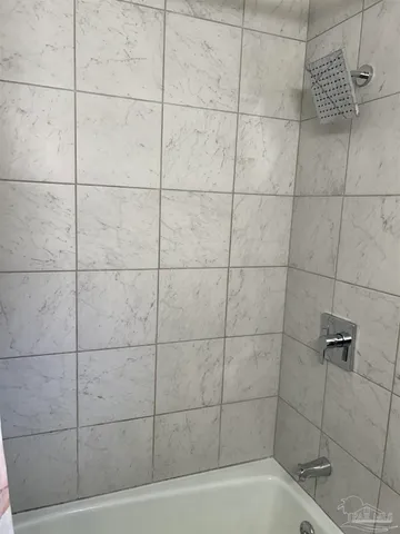 a bathroom with a sink a mirror and vanity