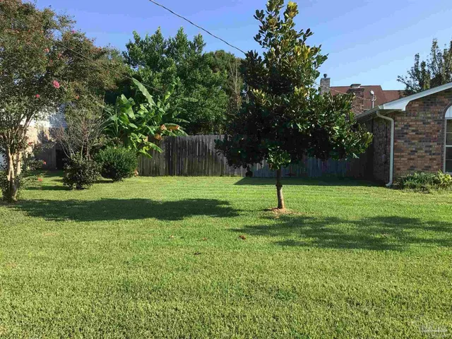 a house view with a play ground in front of it