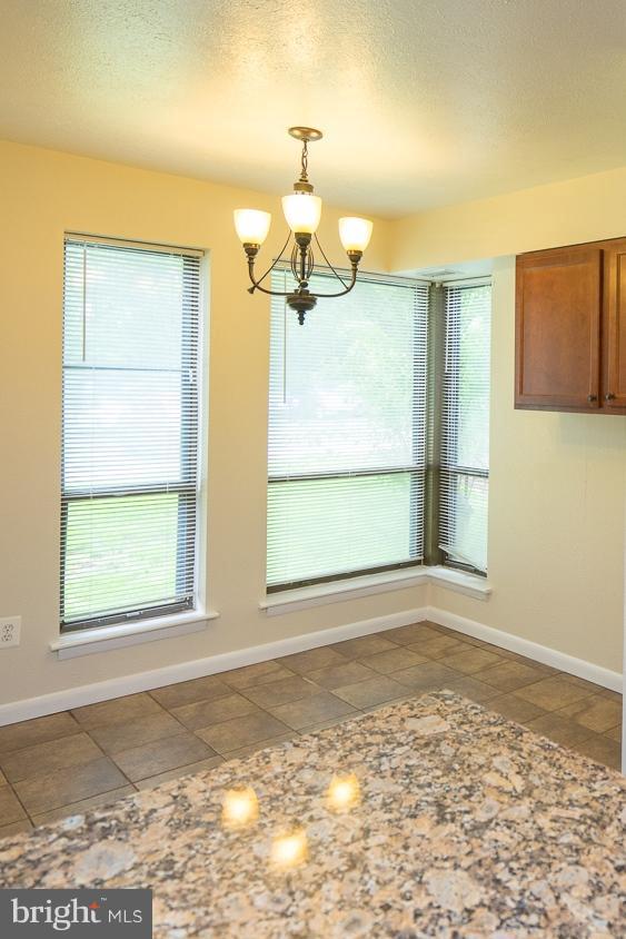 11216 Chestnut Grove Square, Unit 119 Reston, VA 20190 - Photo 4 of 16 Brightly Lit Eat-In Kitchen Area w/Extra Storage