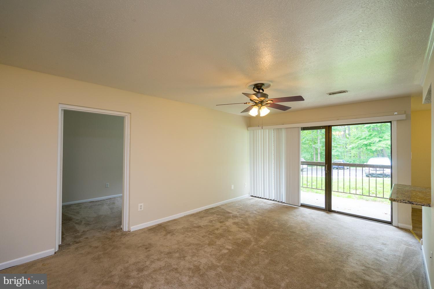 11216 Chestnut Grove Square, Unit 119 Reston, VA 20190 - Photo 9 of 16 Living Room w/Entry to 3rd Bedroom