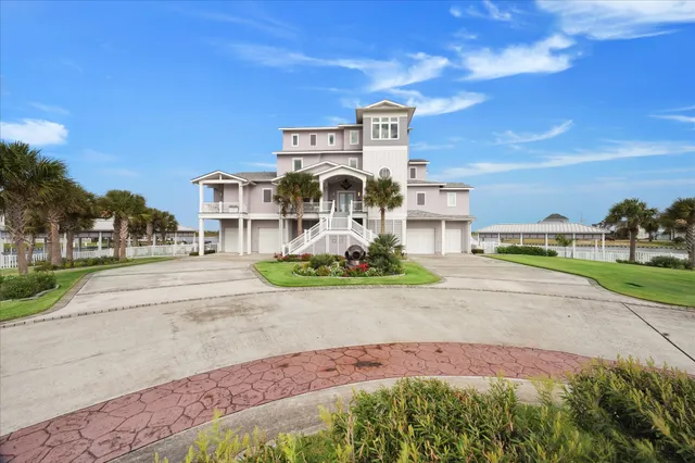 a front view of a house with a garden and pathway