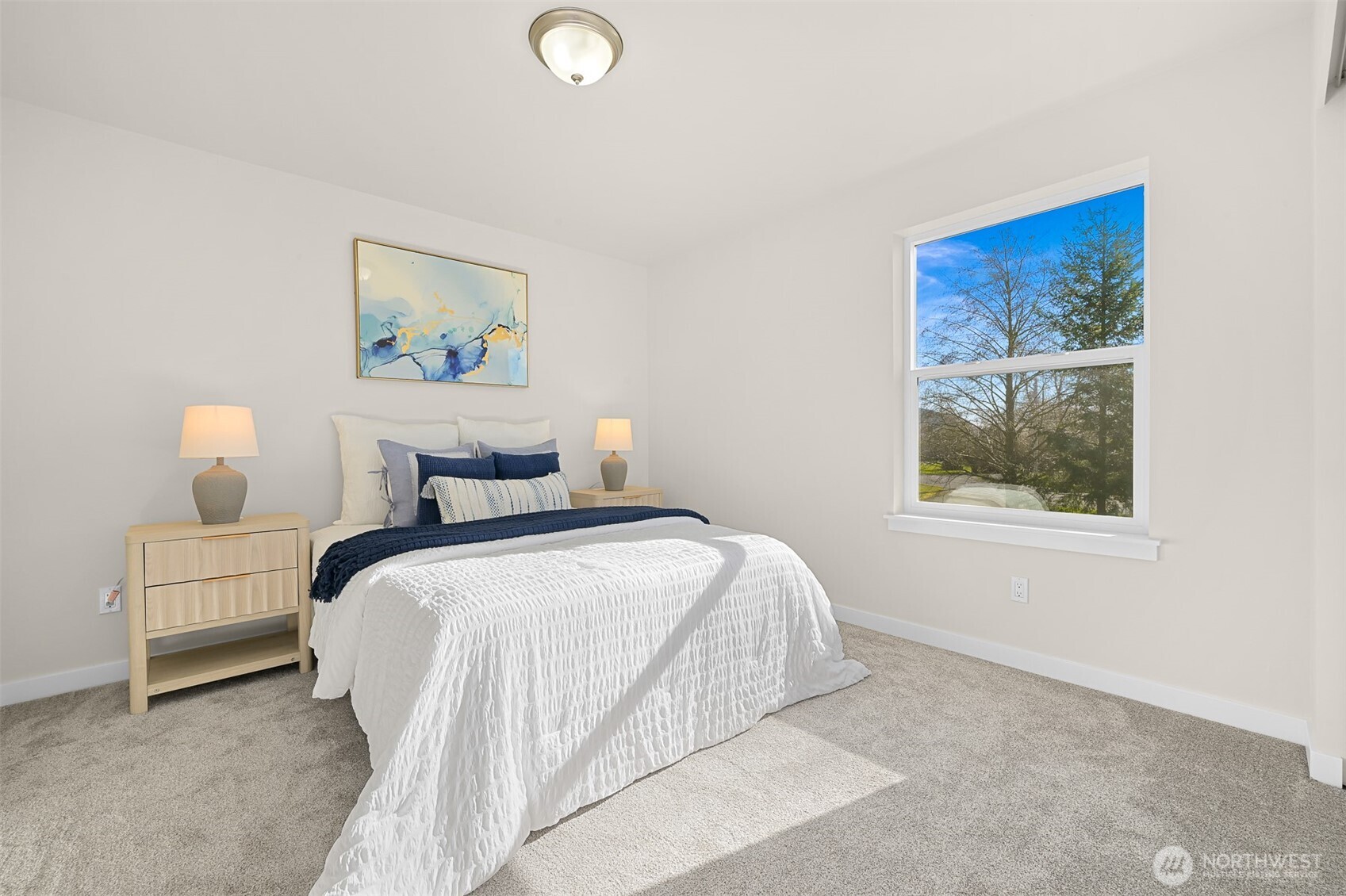 710 A F & S Grade Road, Unit B Sedro-Woolley, WA 98284 - Photo 19 of 38 a bedroom with a bed and a painting on the wall