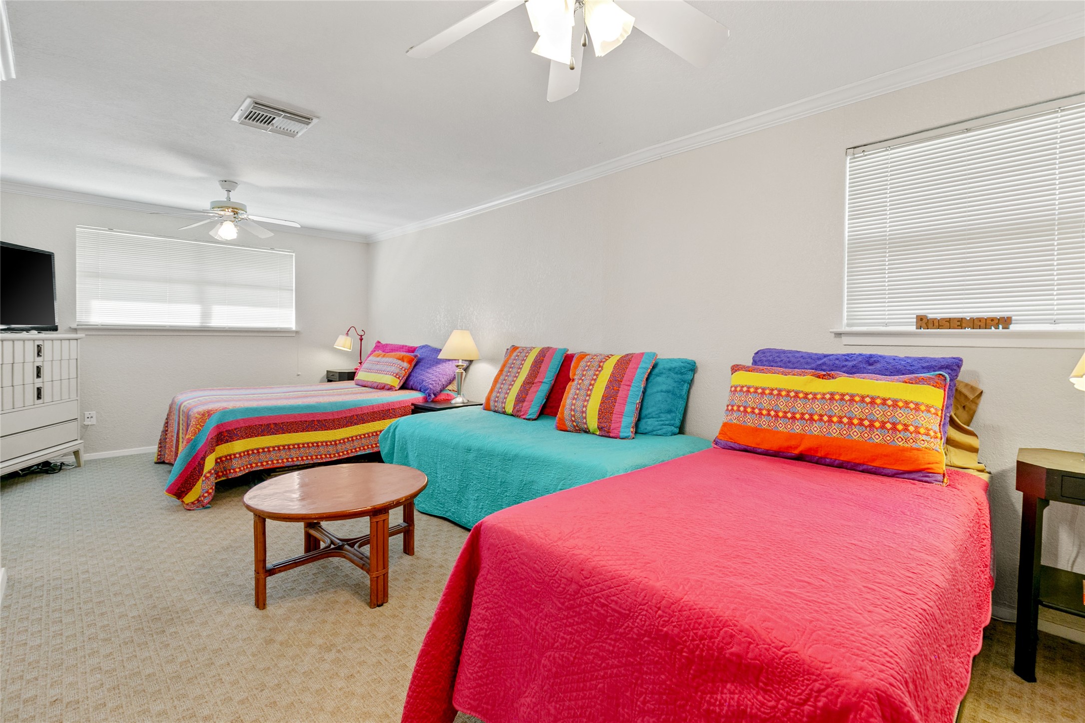 12911 Jolly Roger Drive Freeport, TX 77541 - Photo 24 of 41 a bedroom with 2 bed and a chandelier