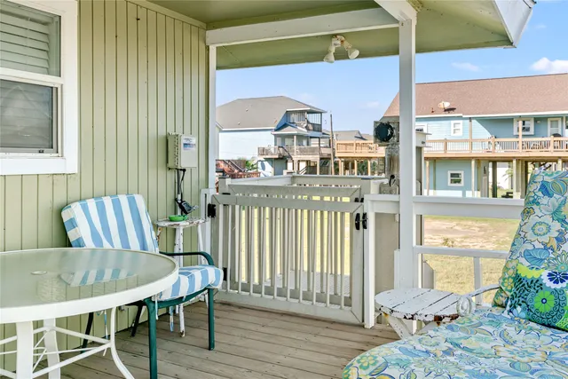 a dining room with furniture a window and stainless steel appliances