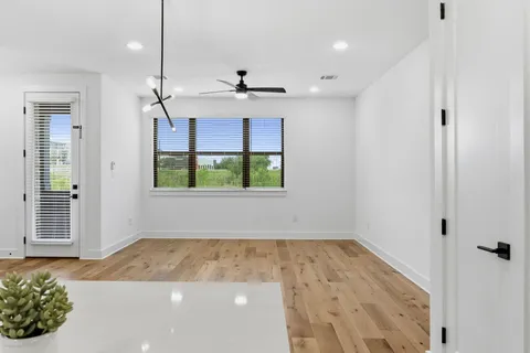 a kitchen with stainless steel appliances a refrigerator sink and microwave
