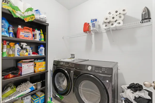 a white toilet sitting next to a shower
