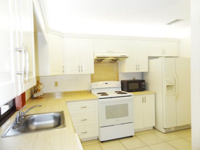 18255 181st Circle South Boca Raton, FL 33498 - Photo 3 of 20 NEW CABINETS W/ LAMINATE COUNTERTOP