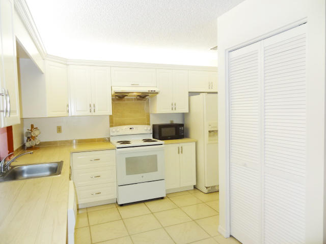 18255 181st Circle South Boca Raton, FL 33498 - Photo 8 of 20 KITCHEN OVERLOOKING POOL