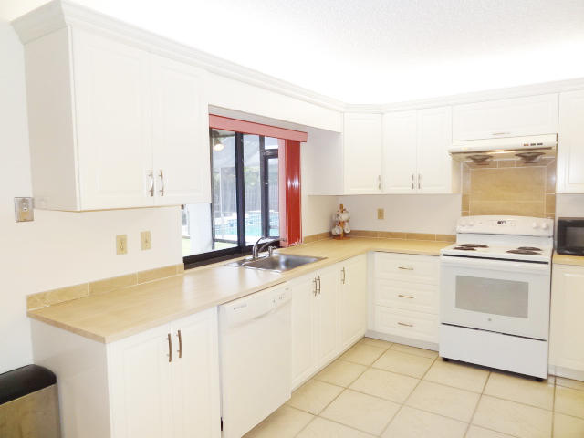 18255 181st Circle South Boca Raton, FL 33498 - Photo 9 of 20 KITCHEN OVERLOOKING POOL