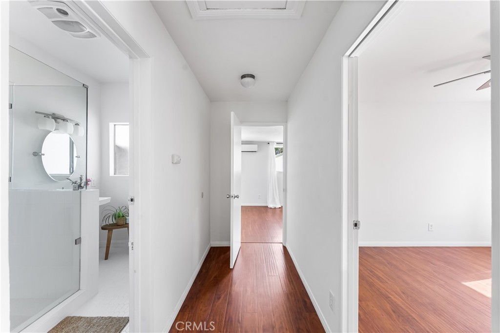 1178 Spence Street Los Angeles, CA 90023 - Photo 14 of 36 a view of a hallway with wooden floor